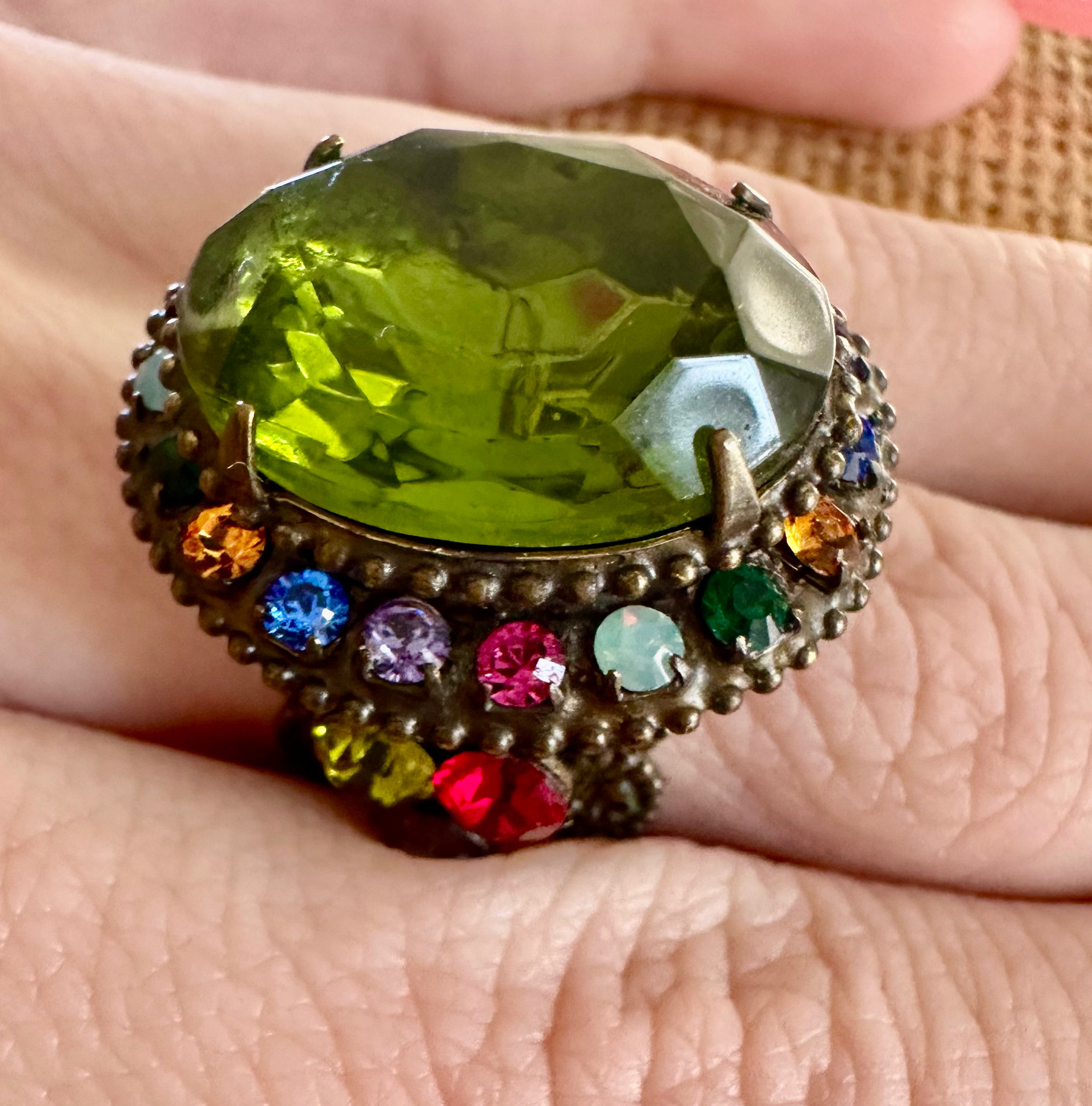 Stylish green gem jewelry ring with elegant design and polished finish