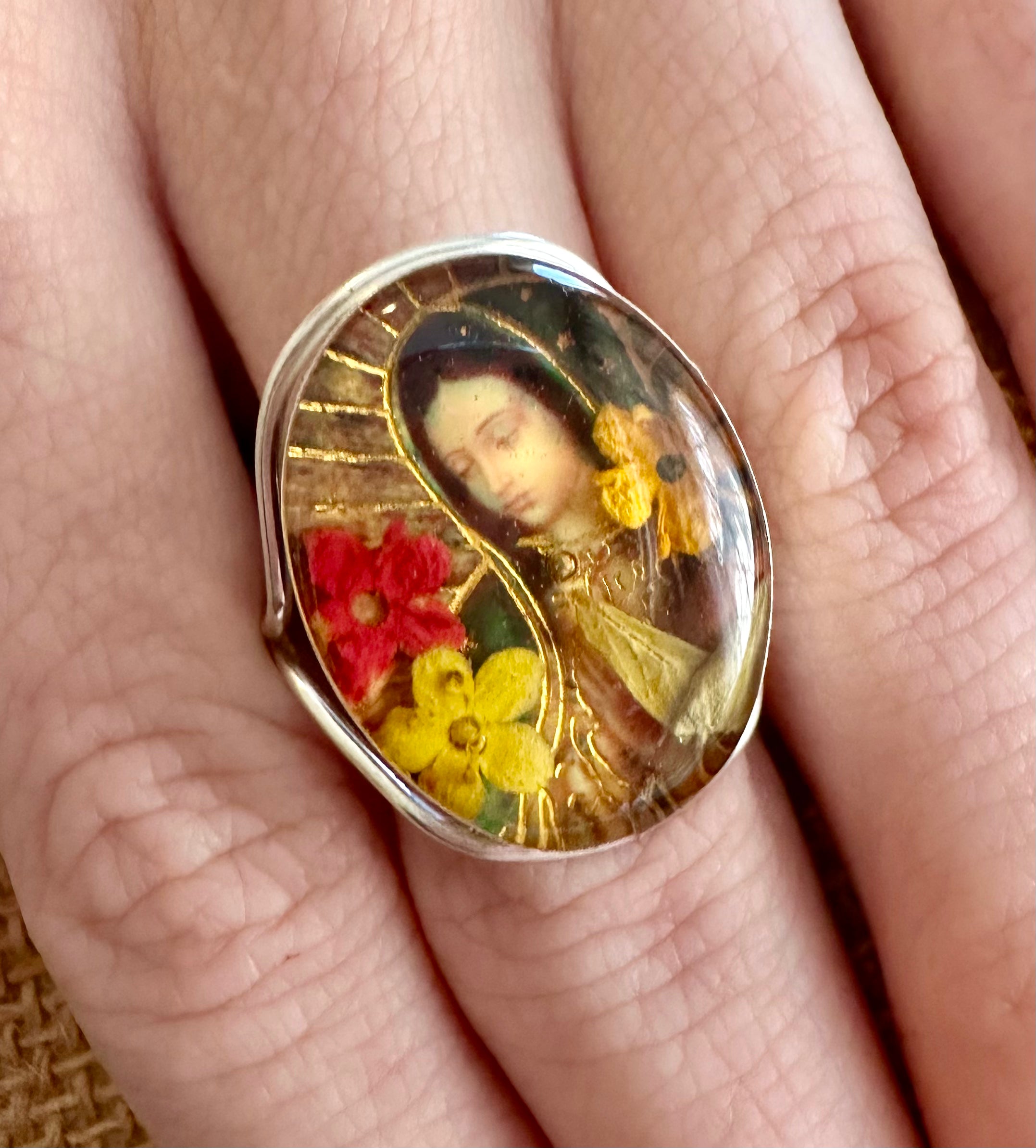 Sterling silver Virgin Mary ring with detailed engraved religious design and polished finish